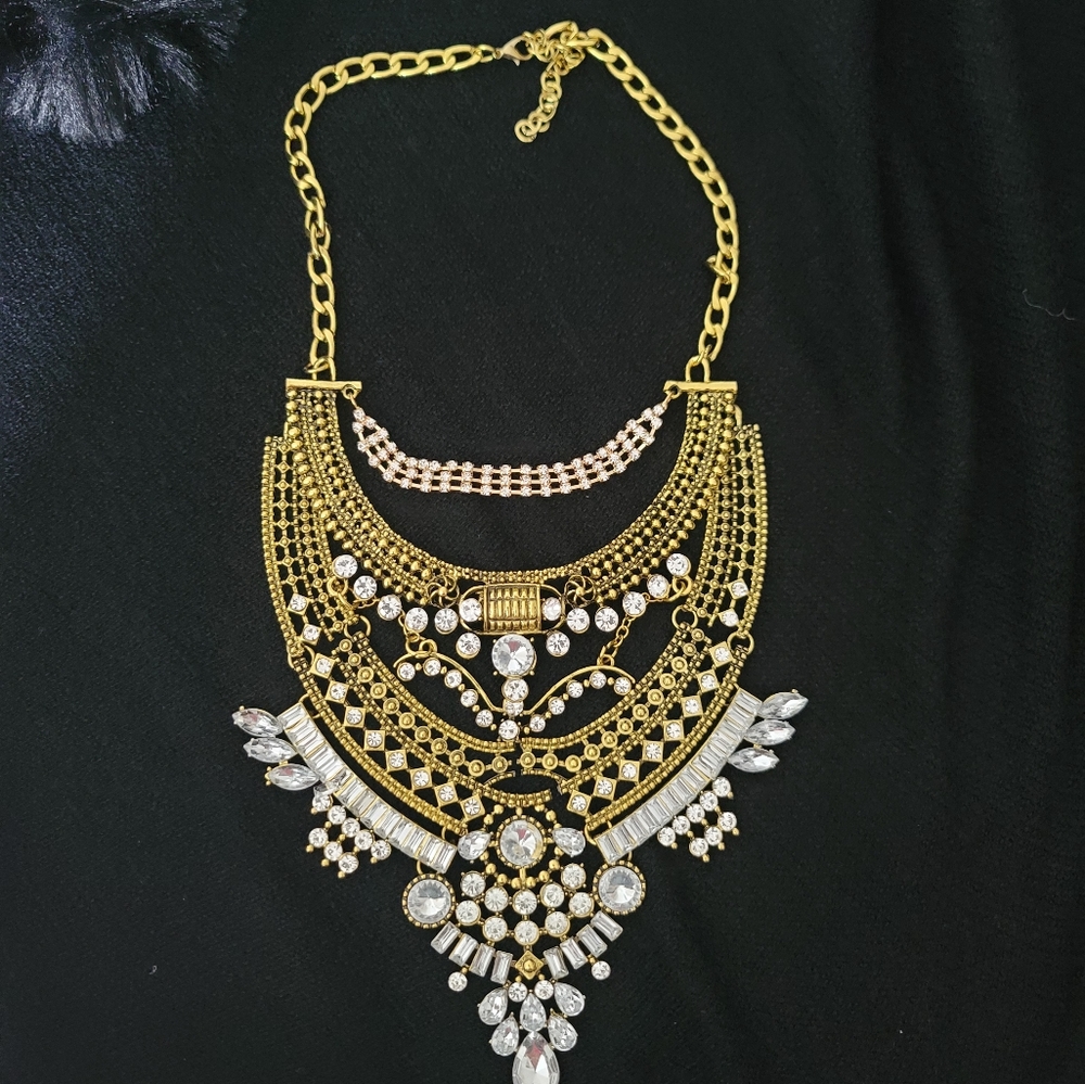 Gold with stunning stones intricate design heavy, chunky necklace